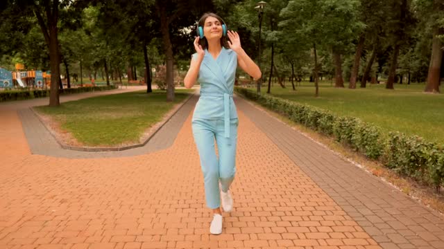 Illustrative stock photo 2: a person enjoying music outdoors